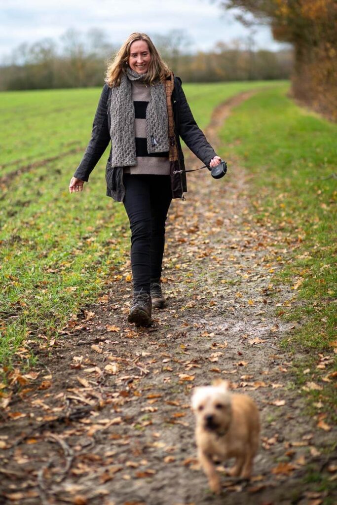 Client walking dog outdoors during brand photoshoot