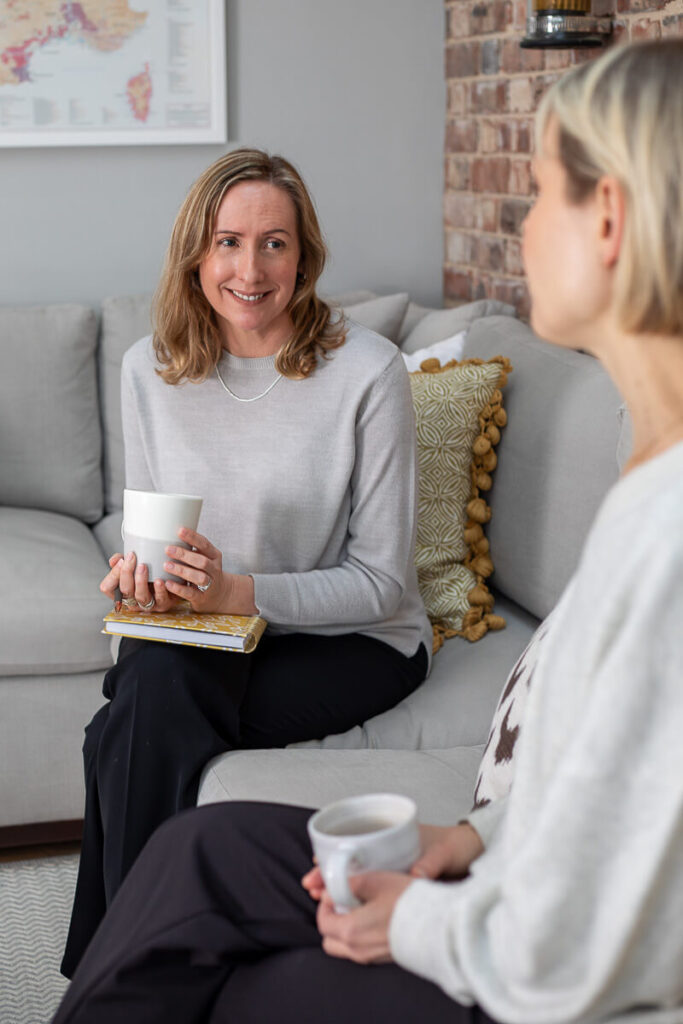 Business coach talking with client during brand shoot