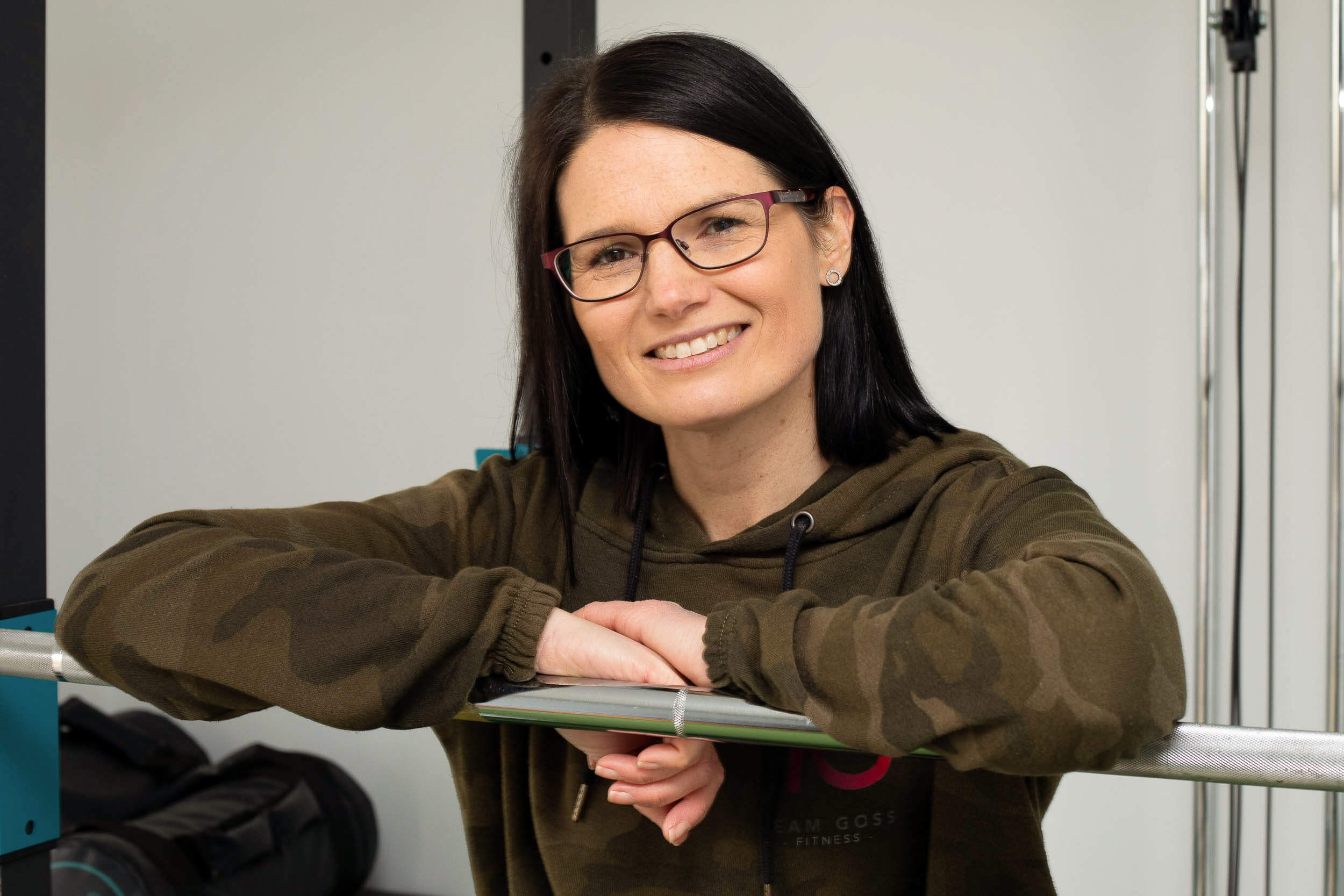 Fitness professional smiling during brand photoshoot