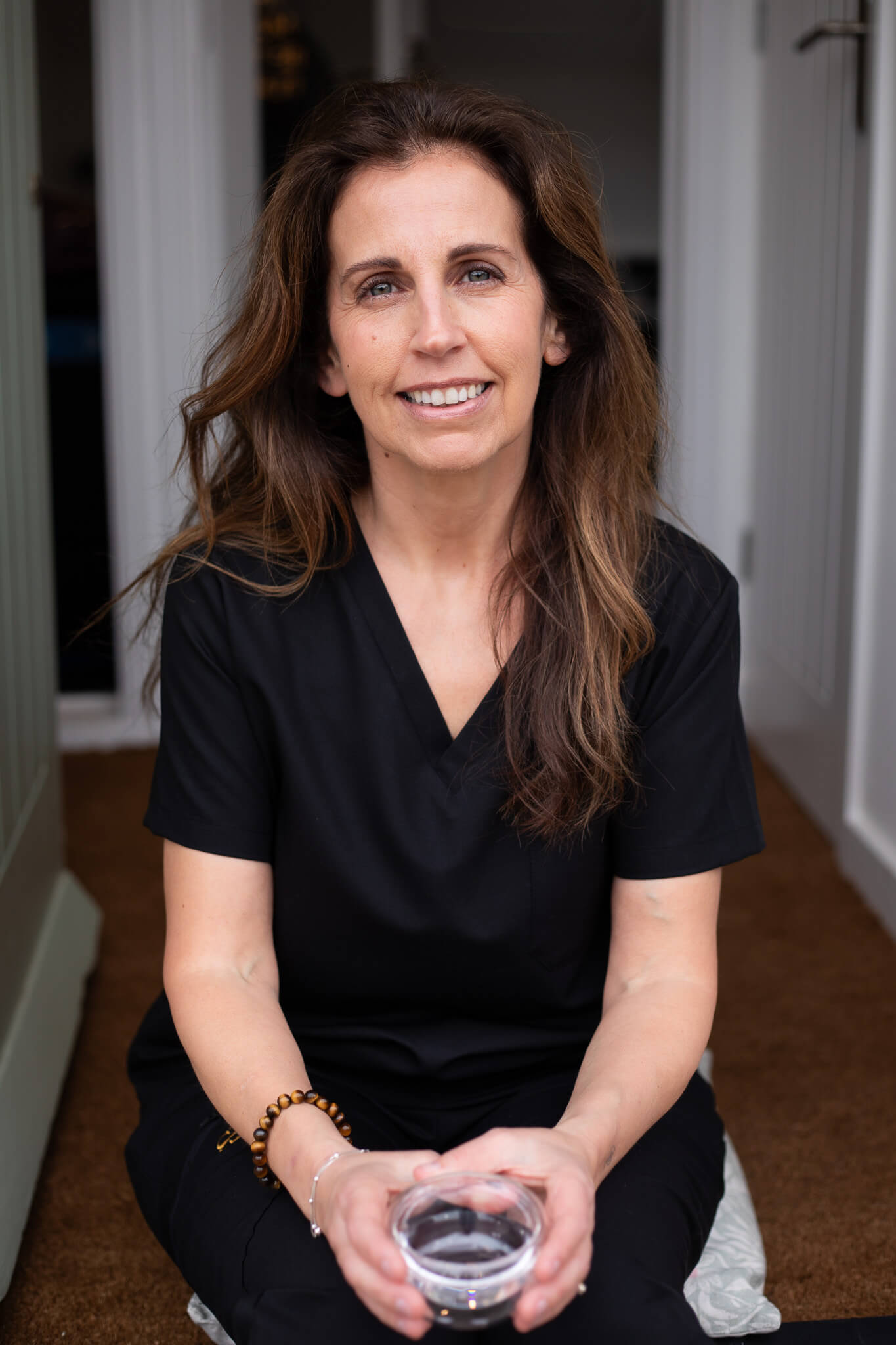 Female entrepreneur sitting outdoors during a photoshoot